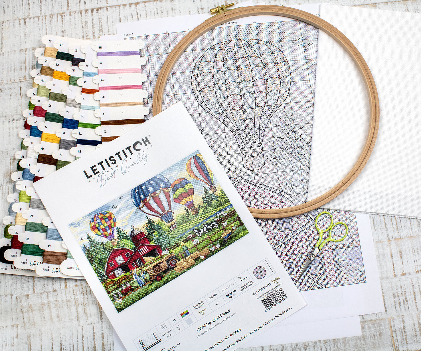 Up Up and Away L8048 Counted Cross Stitch Kit featuring colorful threads, Aida canvas, and detailed instruction chart.